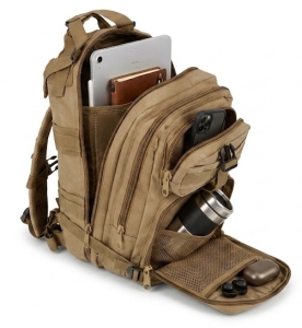 Work‑Day Commuter Pack on a floor with a few business items such as tablet, cell phone, notebook