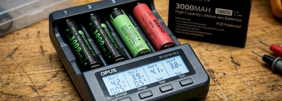 battery analyzer Opus BT-C3100 testing batteries on a wood workshop table