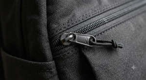 view of a black nylon fanny bag showing the zipper
