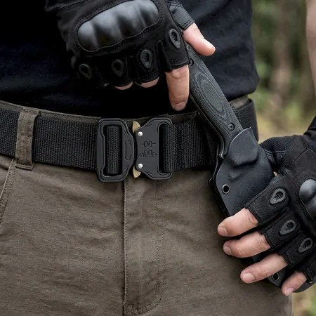 man wearing tactical riggers belt and fingerless hard knuckle gloves