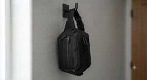CCW fanny pack hanging by its strap on a wall hook
