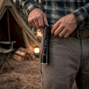 attached to belt with a clip at night on camping site