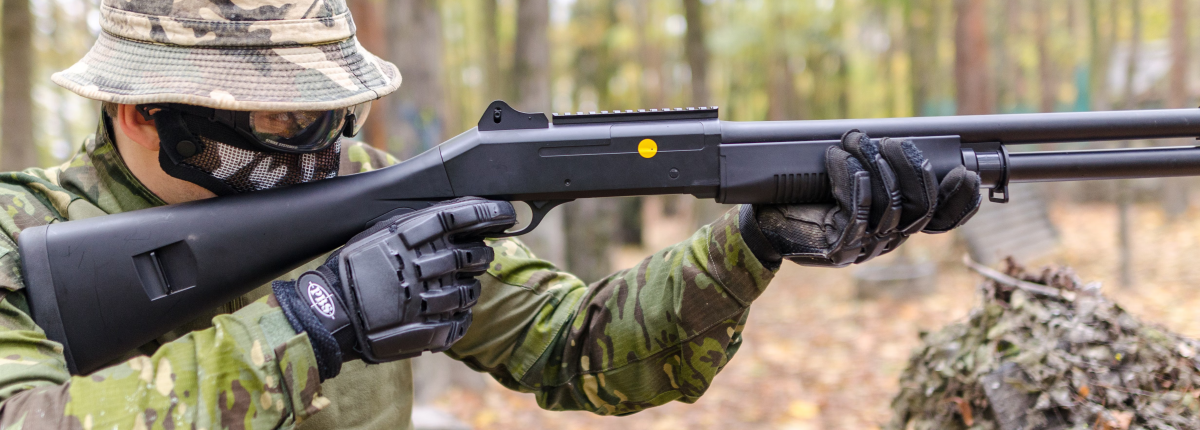 man in forest performing hunting and shooting activities