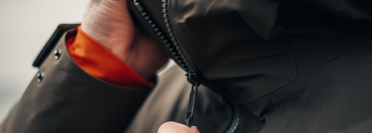 man wearing three‑layer system clothing