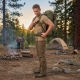 Man wearing a 30 liter tactical backpack with proper posture. Man is showing adjusted straps and waist belt