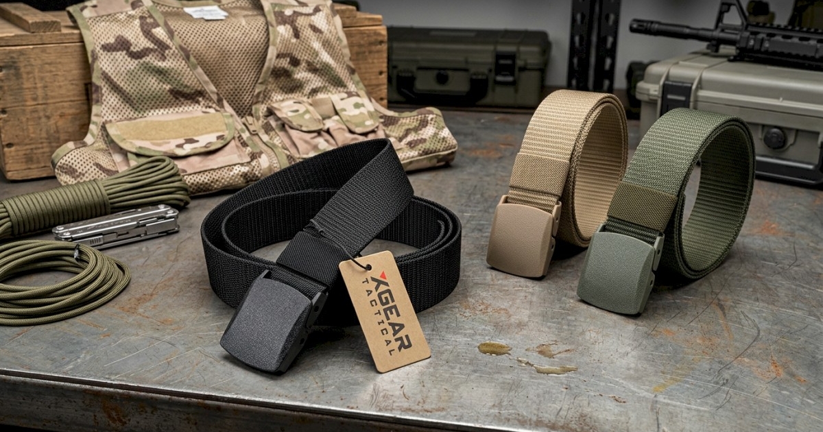 group of nylon utility belts on a steal table with other small outdoor gear