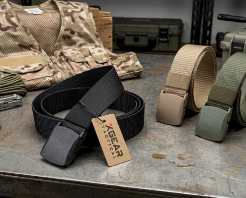 group of nylon utility belts on a steal table with other small outdoor gear