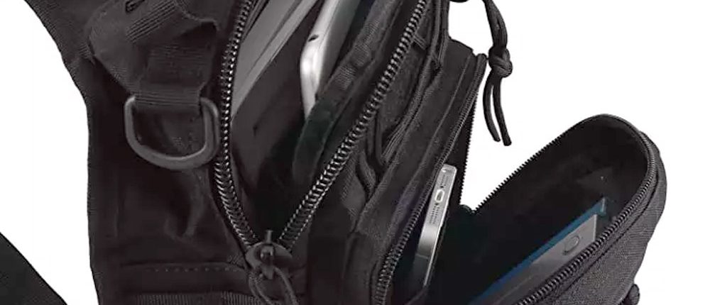 tactical sling shoulder bag storage showing multiple exterior pouches open
