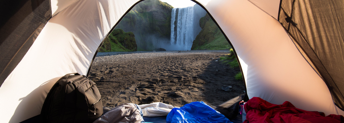 tent opened with sleeping bags and pillows inside