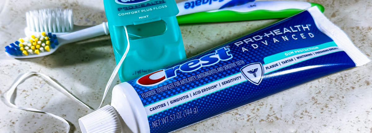 Personal Hygiene items including toothbrush, toothpaste, floss and towel