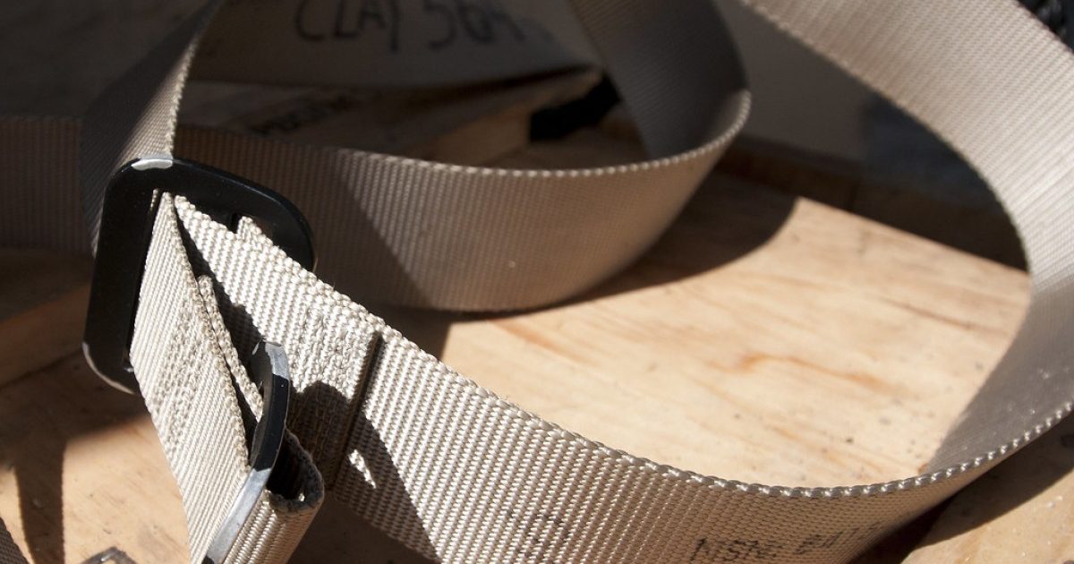 table with a khaki riggers belt showing a close-up view